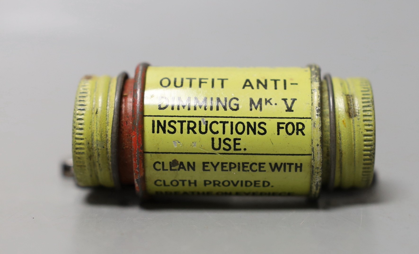 An Airforce cap. a Kitchener commemorative matchboc, a WWI uniform repair kit and a bincoluar lens cleaning kit